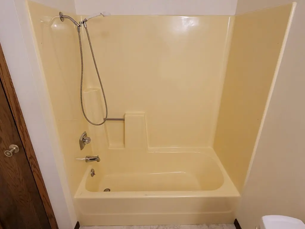 Yellow tub and shower area