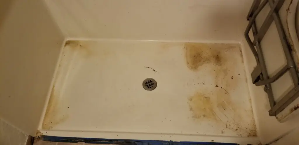 A dirty shower floor