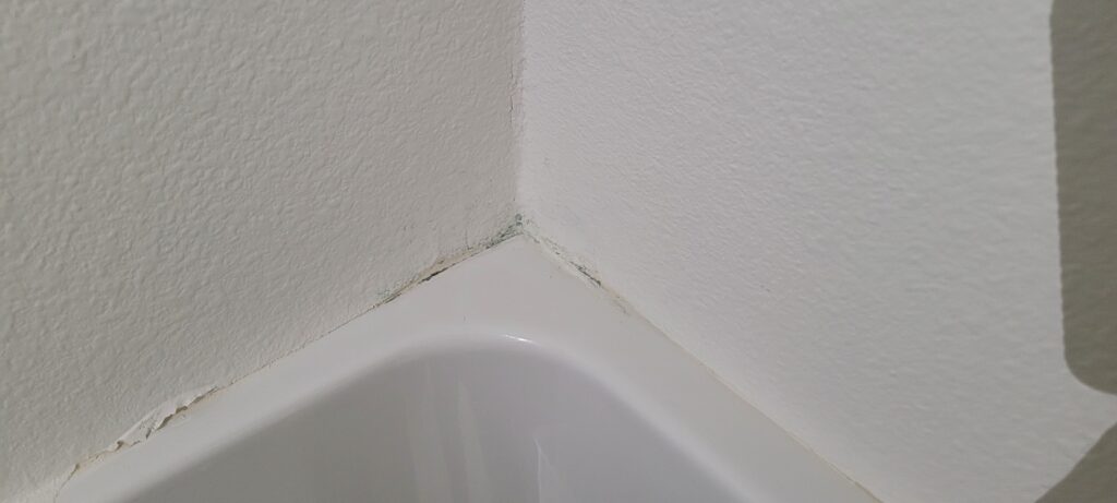 Repaired bathtub corner