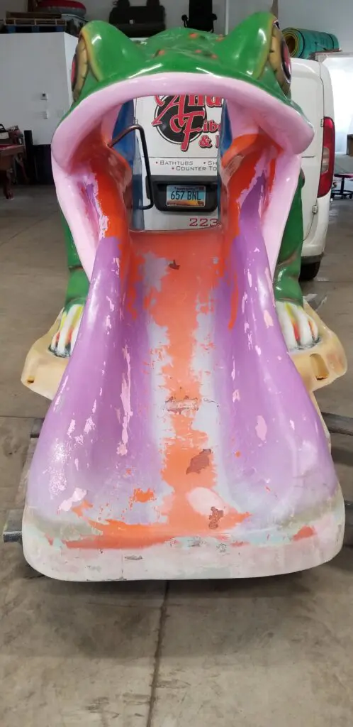 Frog slide with worn-out paint